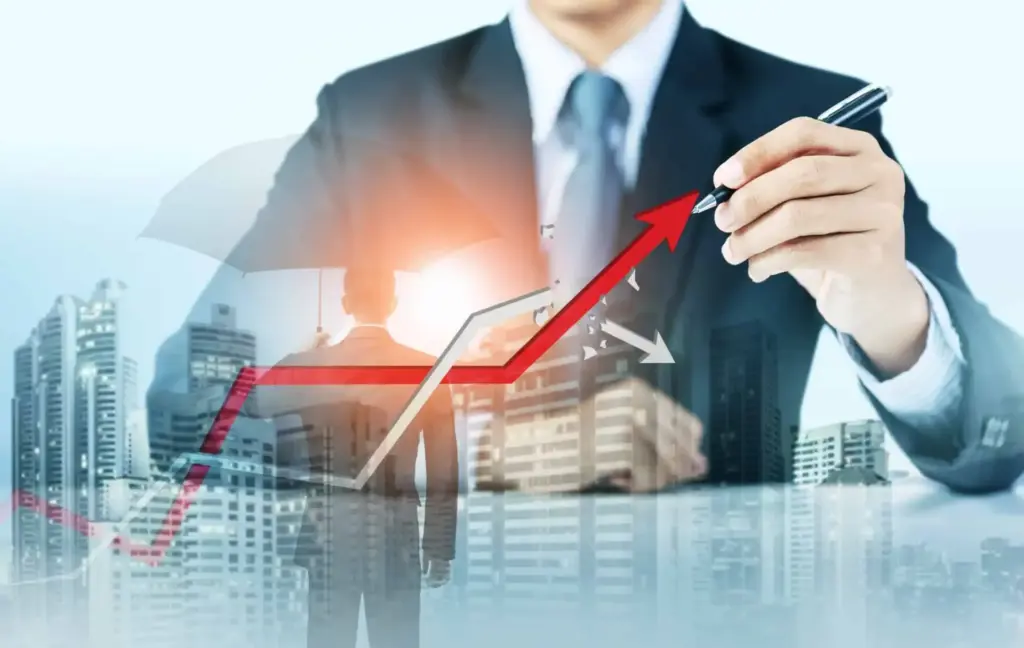 Imagem de um homem de terno analisando um gráfico de crescimento com uma seta apontando para cima, simbolizando sucesso financeiro e crescimento de negócios.